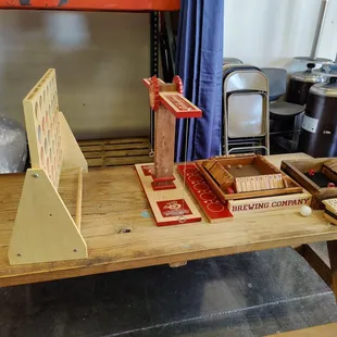 a wooden table with boxes of beer