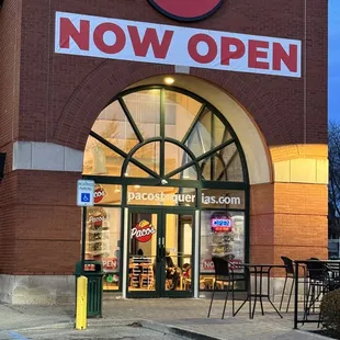 a taco's now open sign