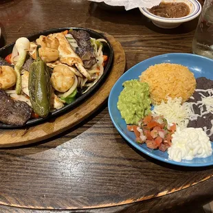 My entree. I believe it was fish, shrimp, and steak. I only liked the shrimp and the sides.