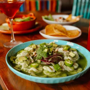 Aguachiles verdes- butterfly shrimp marinated in lime and pepper, served with onion, cucumber, and cilantro. Spicy and refreshing.