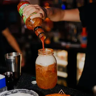 Michelada- clamato, beer, tabasco, tajin, chamoy, valentina