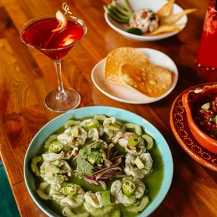 Aguachiles verdes- butterfly shrimp marinated in lime and pepper, served with onion, cucumber, and cilantro. Spicy and refreshing.