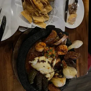 The molcajete. The cactus and that juicy sauce is amazing.