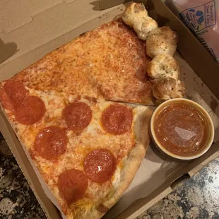 Slice of pepperoni and a slice of the amazing garlic roll crust pizza