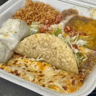 Enchilada, mini burrito, taco, rice and beans