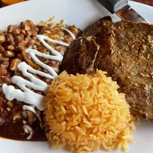 This was yummy! Carne Asada, cheese enchiladas, beans and Spanish rice.