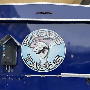 a taco truck parked at a gas station