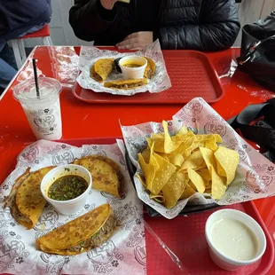 Birria tacos (rock tacos) and chips with queso