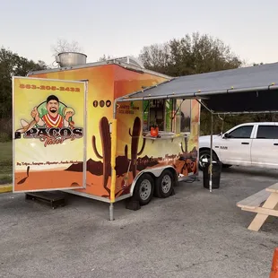 a taco truck parked in a parking lot