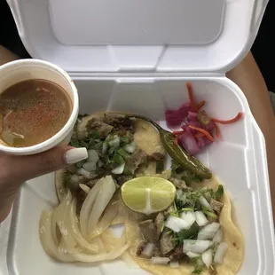 Tacos de tripa with pickled purple onion/carrots, grilled onion and jalapeño.