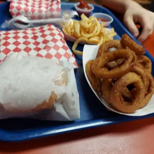 a tray of food with onion rings, onion rings, and ketchup