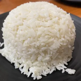 rice on a black plate
