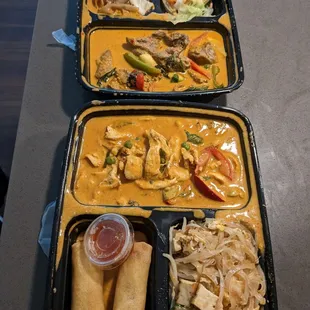 Beef panang curry bento with pad see ew and steamed veggies. Chicken panang curry bento with imperial rolls and pad thai