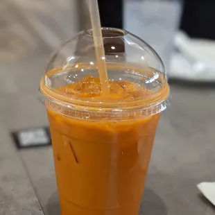 a plastic cup with a straw in it