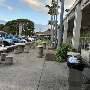 a parking lot with tables and benches