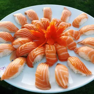 a plate of sushi on a lawn