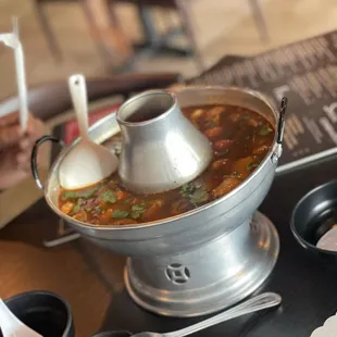 a hot pot of soup