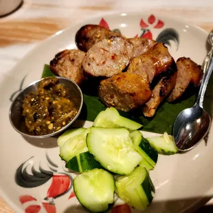 SAI OUA Spicy herbal pork sausage, charred green chili sauce