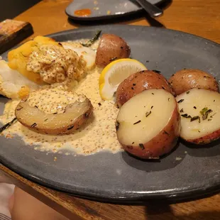 STUFFED COD: Flakey cod stuffed with sauce and potato accompanied by red potatoes.