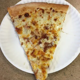 Slice of chicken bacon ranch pizza