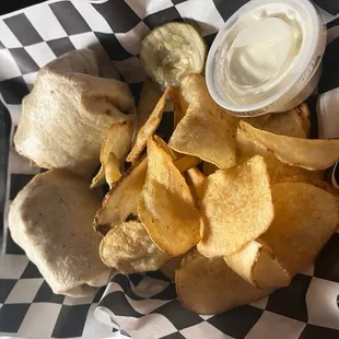 a basket of chips and dip