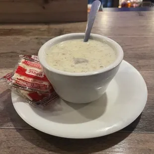 a bowl of soup and a bag of chips