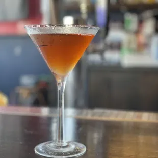 a cocktail in a martini glass