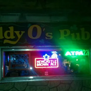 a neon sign for paddy o's pub