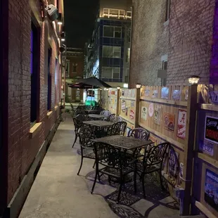 tables and chairs on the sidewalk