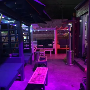 a patio with purple lighting