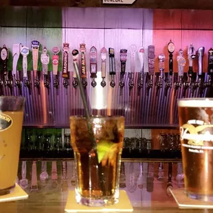 a row of beer taps