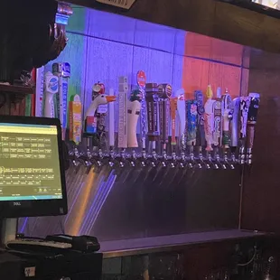 a row of beer taps