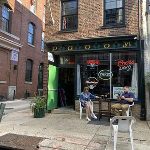 two people sitting outside