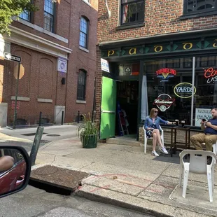 two men sitting outside