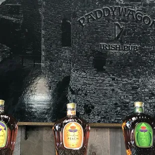 a row of bottles of whiskey