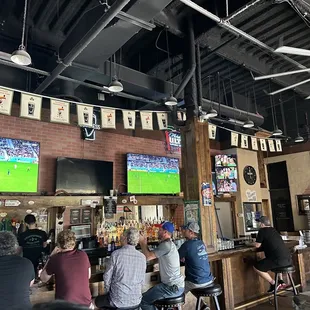 eople sitting at the bar