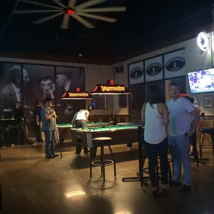 Pool tables, dart boards, TVs and lots of alcohol.