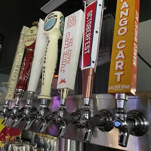 a row of beer taps
