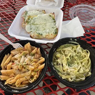 Cajun chicken pasta, chicken pesto pasta, and pesto bread.