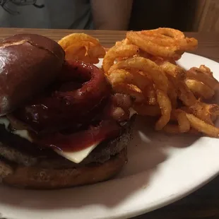 Western burger on pretzel bun with curly fries. Approx $9