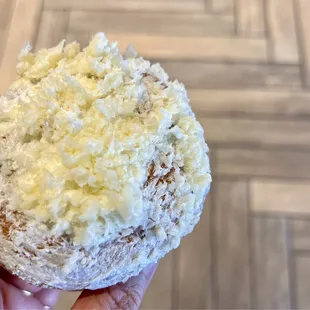 Ensaymada (with Aged White Cheddar). Soft brioche bread rolled like a cinnamon roll with butter, sugar, and aged white cheddar on top.