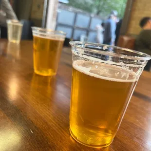 two glasses of beer on a table