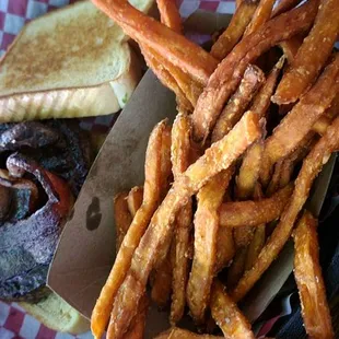 Bacon-bbq burger on Texas toast with a side of sweet potato fries