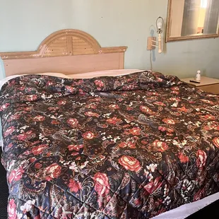 Bed, not made and likely unchanged