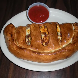 a plate of bread with a side of ketchup