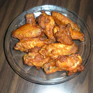 a plate of chicken wings