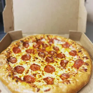 a pepperoni pizza in a box