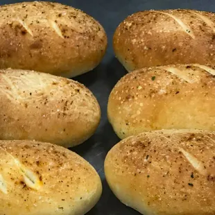 We bake our fresh garlic loaves each day! Each of our dinners is served with one.
