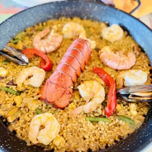 a pan of seafood and rice