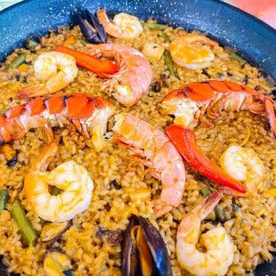 a pan of seafood and rice